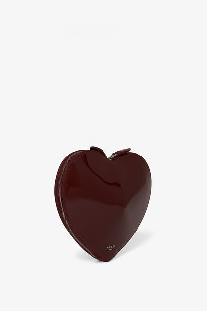 Alaïa | Le Coeur dark red patent crossbody bag | Savannahs