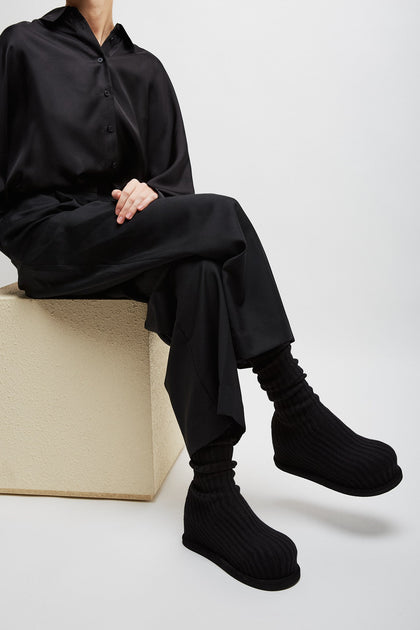 Amina Muaddi | Veneda platform black knitted stretch boots