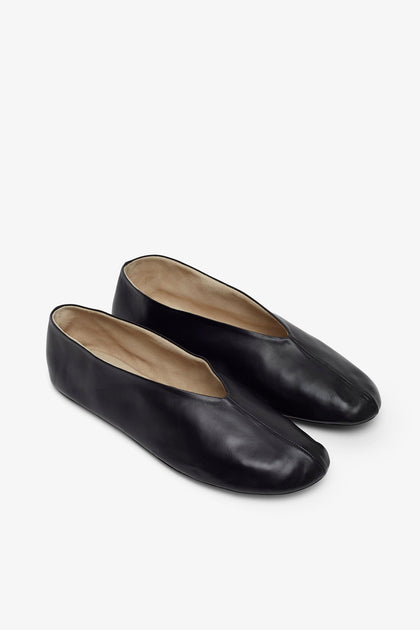 The Row | Stella black slippers | Savannahs