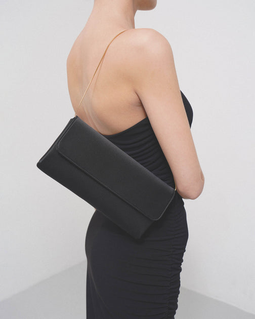 The Row Aurora black satin clutch Savannahs