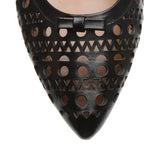 Pointed black leather ballet flats