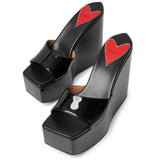 Color Wedge 120 black patent mules
