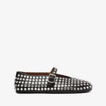 Black studded flat shoe on a white background