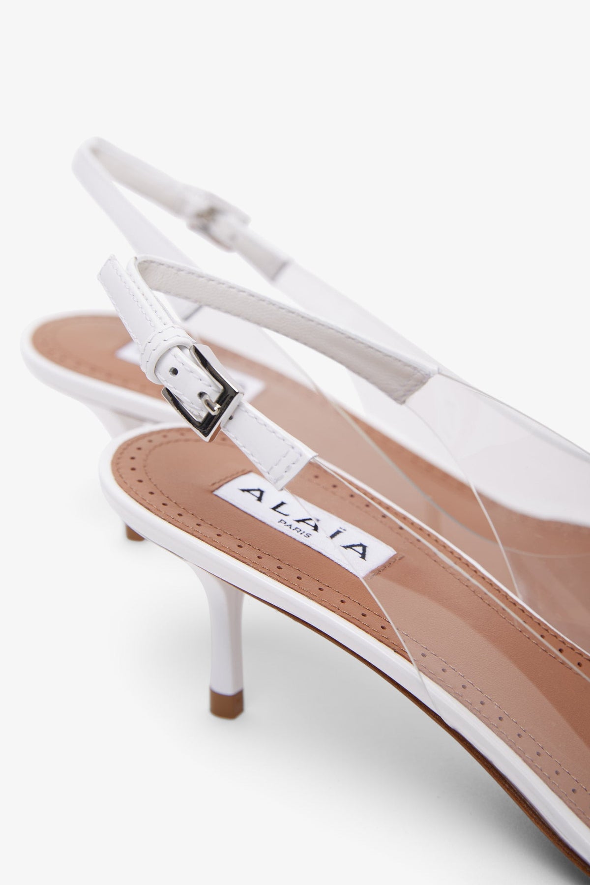 ALAÏA LE COEUR PATENT WHITE SLINGBACKS 