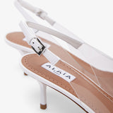 Coeur 55 white patent slingbacks