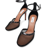 Black mesh pumps
