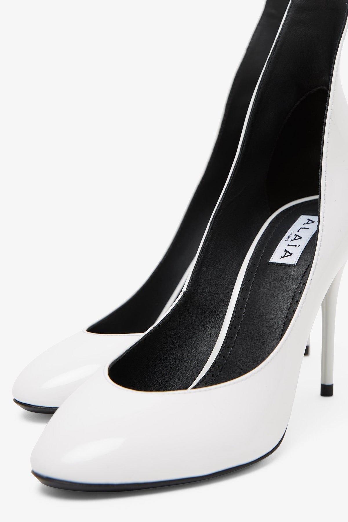 Shop Alaïa Pumps 90 White Patent Pumps