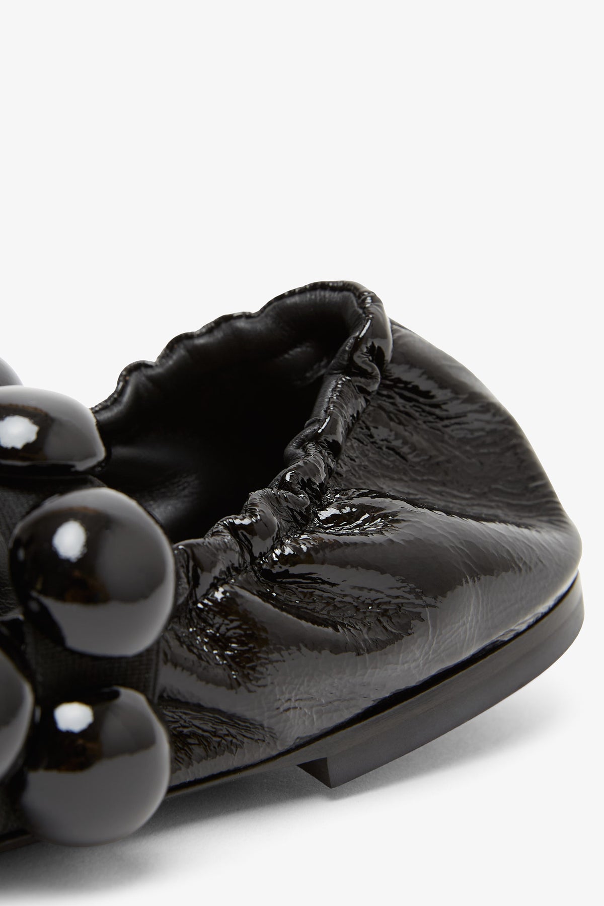 Shop Alaïa Sphere Patent Leather Ballerinas