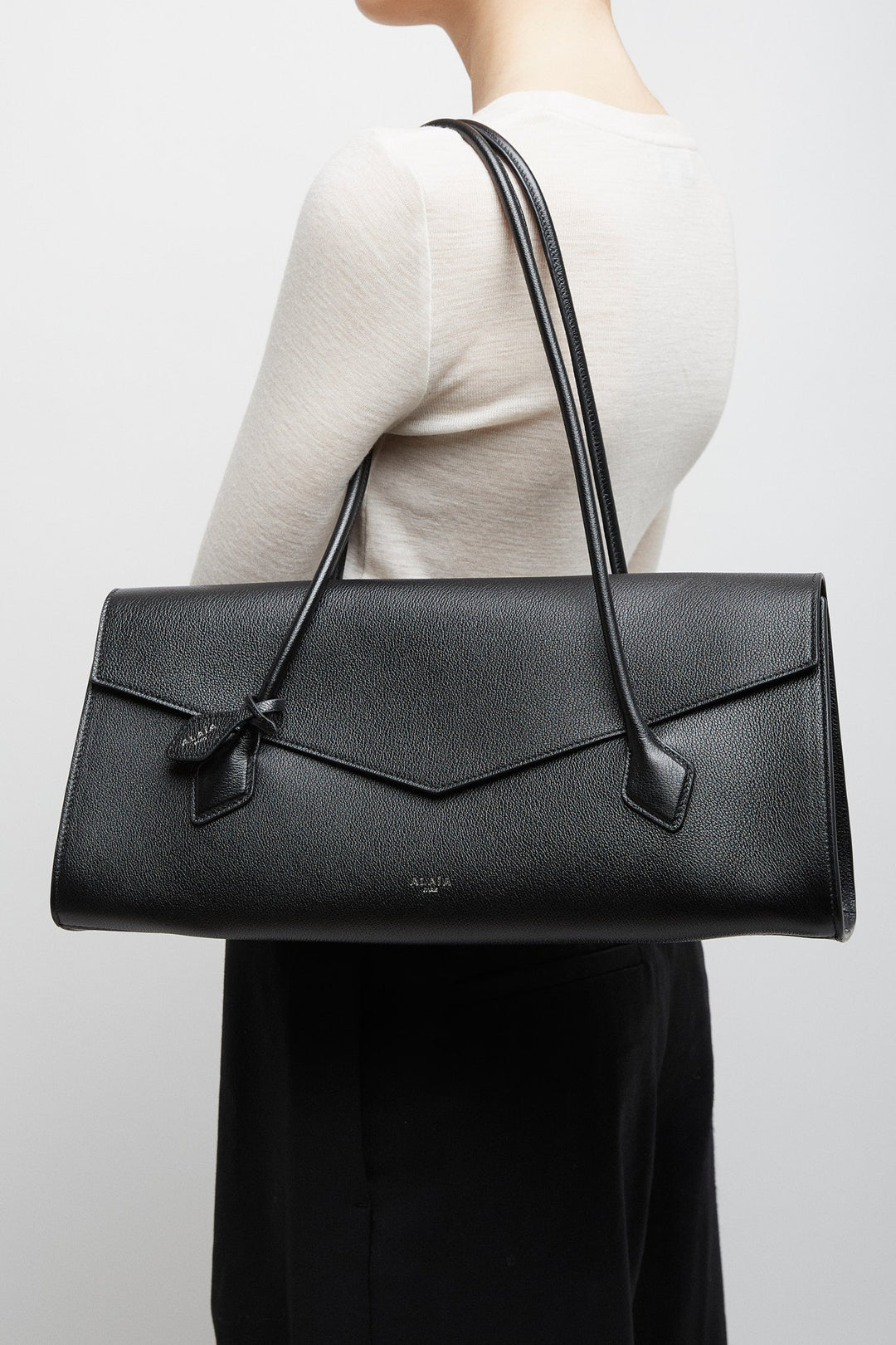 Alaïa | Le Teckel Flap black bag | Savannahs