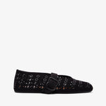 Black sneakers with white soles on a white background