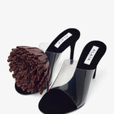 Asymmetric suede pom pom sandals