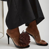 Asymmetric suede pom pom sandals