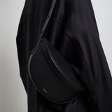 Hip east west black leather bag