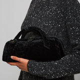 Le Teckel black shearling clutch