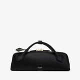 Black handbag with gold accents on a white background
