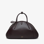 Brown leather handbag with a handle on a white background