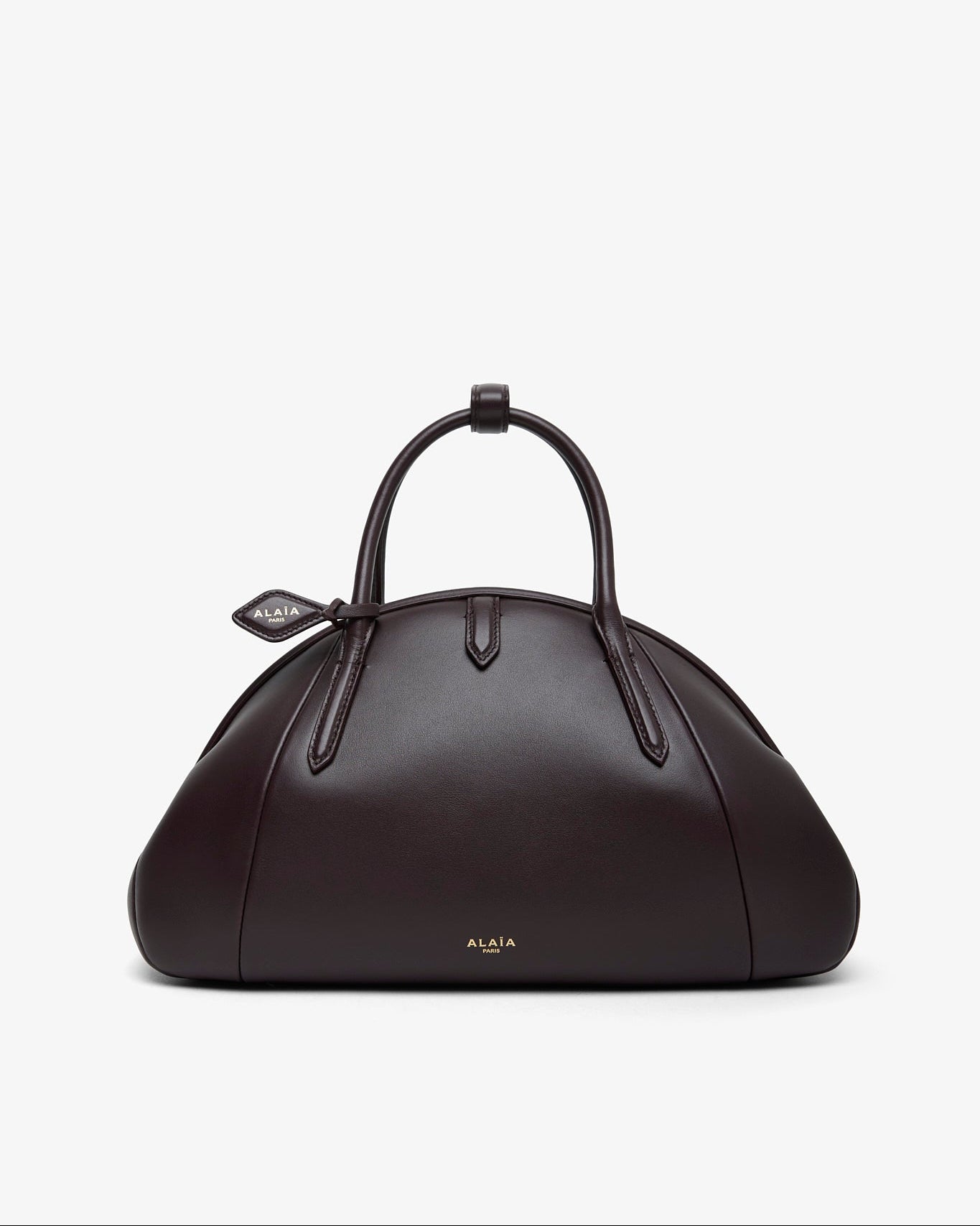 Brown leather handbag with a handle on a white background