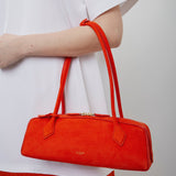 Le Teckel Medium orange suede bag