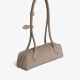 Le teckel small light taupe suede bag