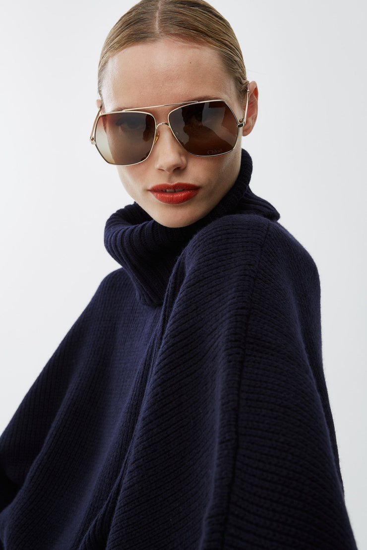 Short dark blue turtleneck cape