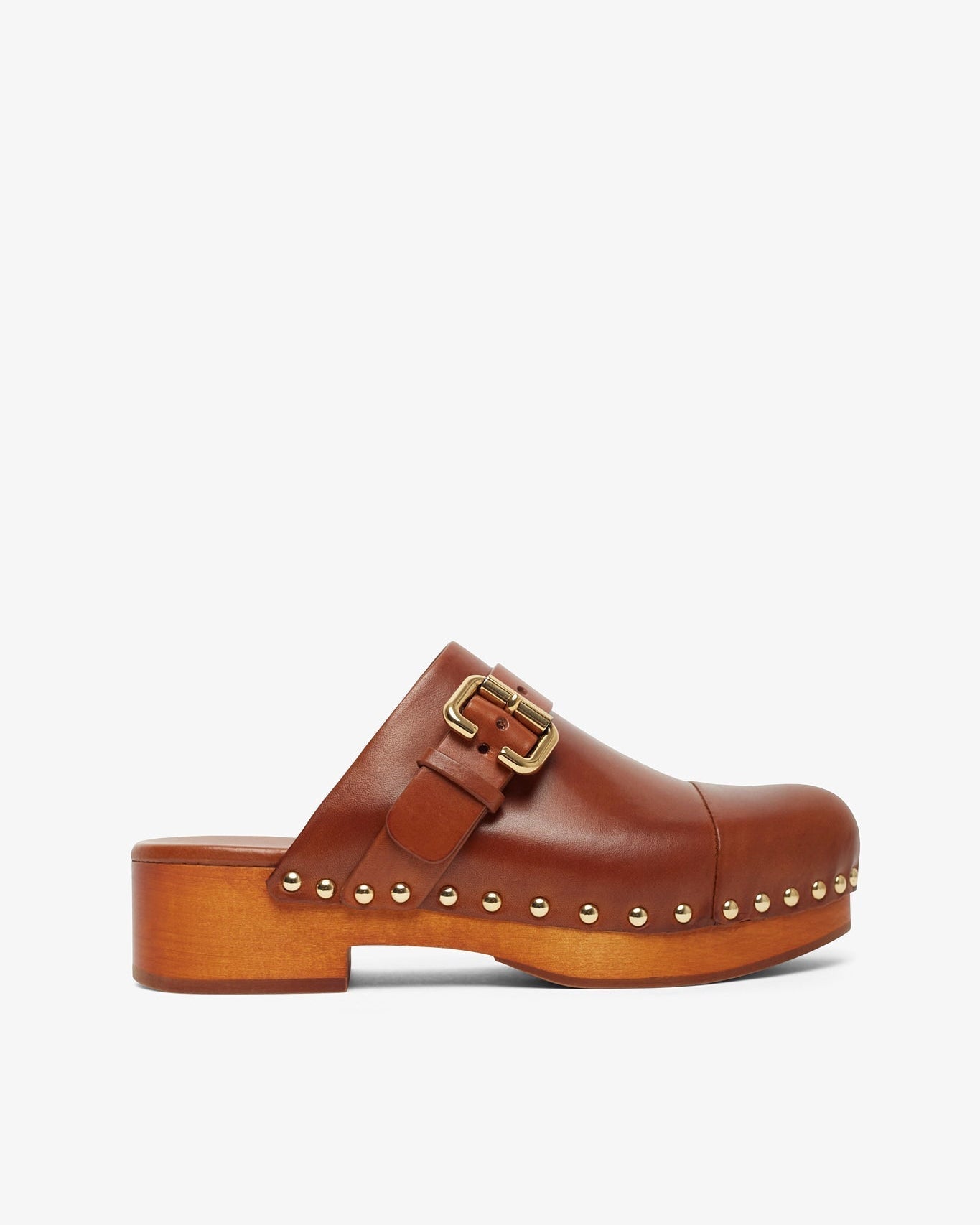 Brown leather clog shoe with gold buckle and studs on a white background