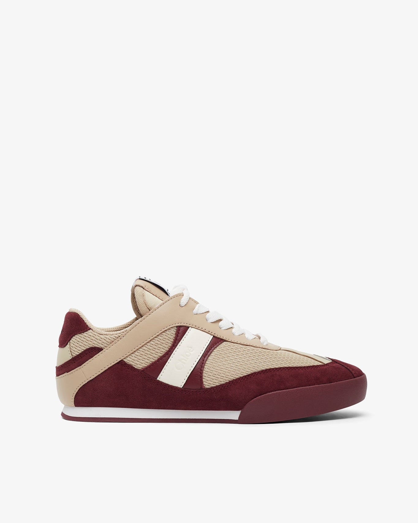 Beige and burgundy sneaker on a white background