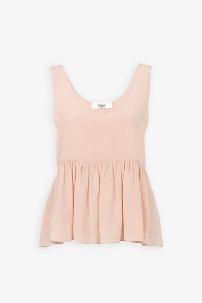 Delicate pink peplum silk top
