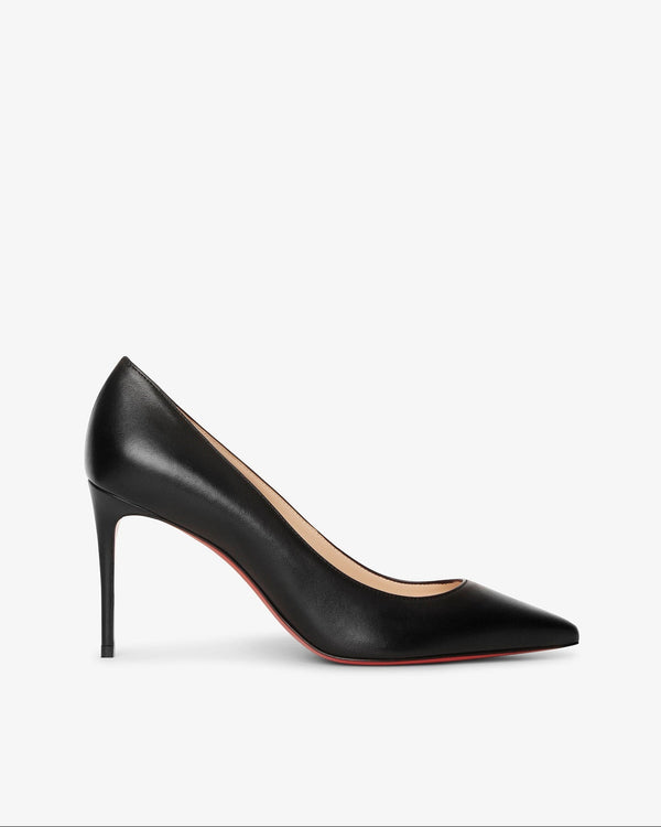 Black high-heeled shoe on a light gray background