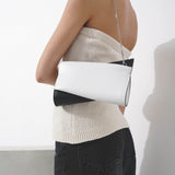 Loubitwist small black and white clutch bag
