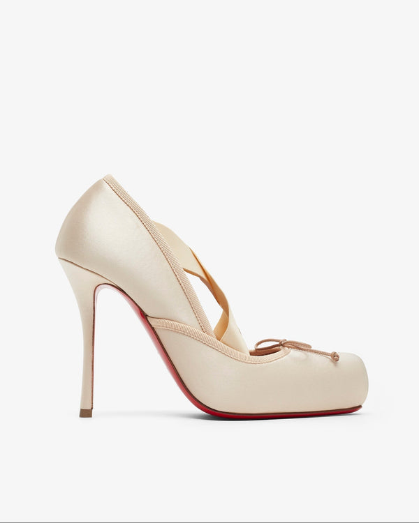 Beige high-heeled shoe on a white background