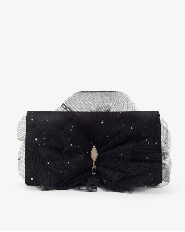 Black clutch with a large bow and star-like embellishments on a white background