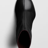 Tug black leather ankle boots