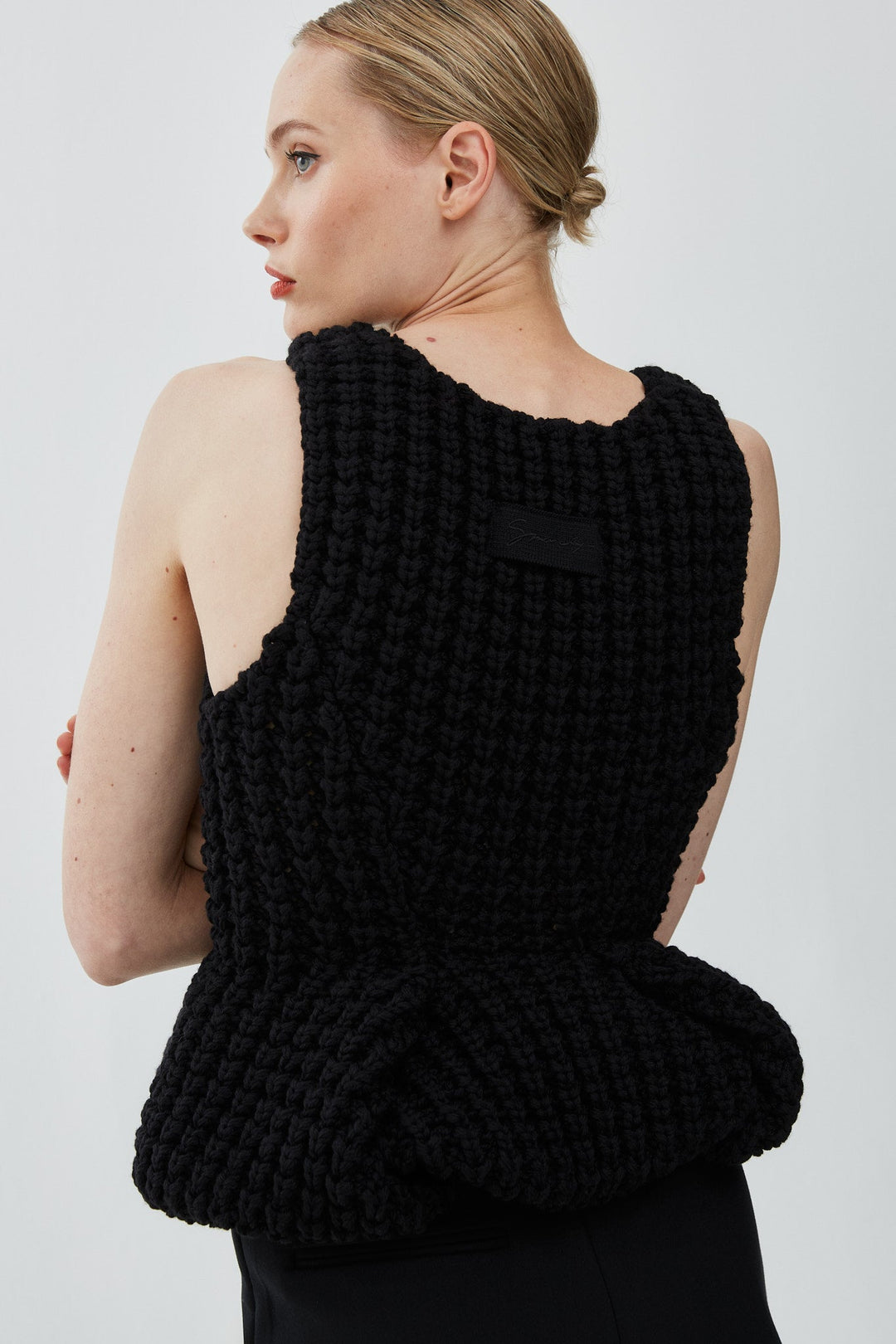 Givenchy | Slim fit peplum black top in waffle wool | Savannahs