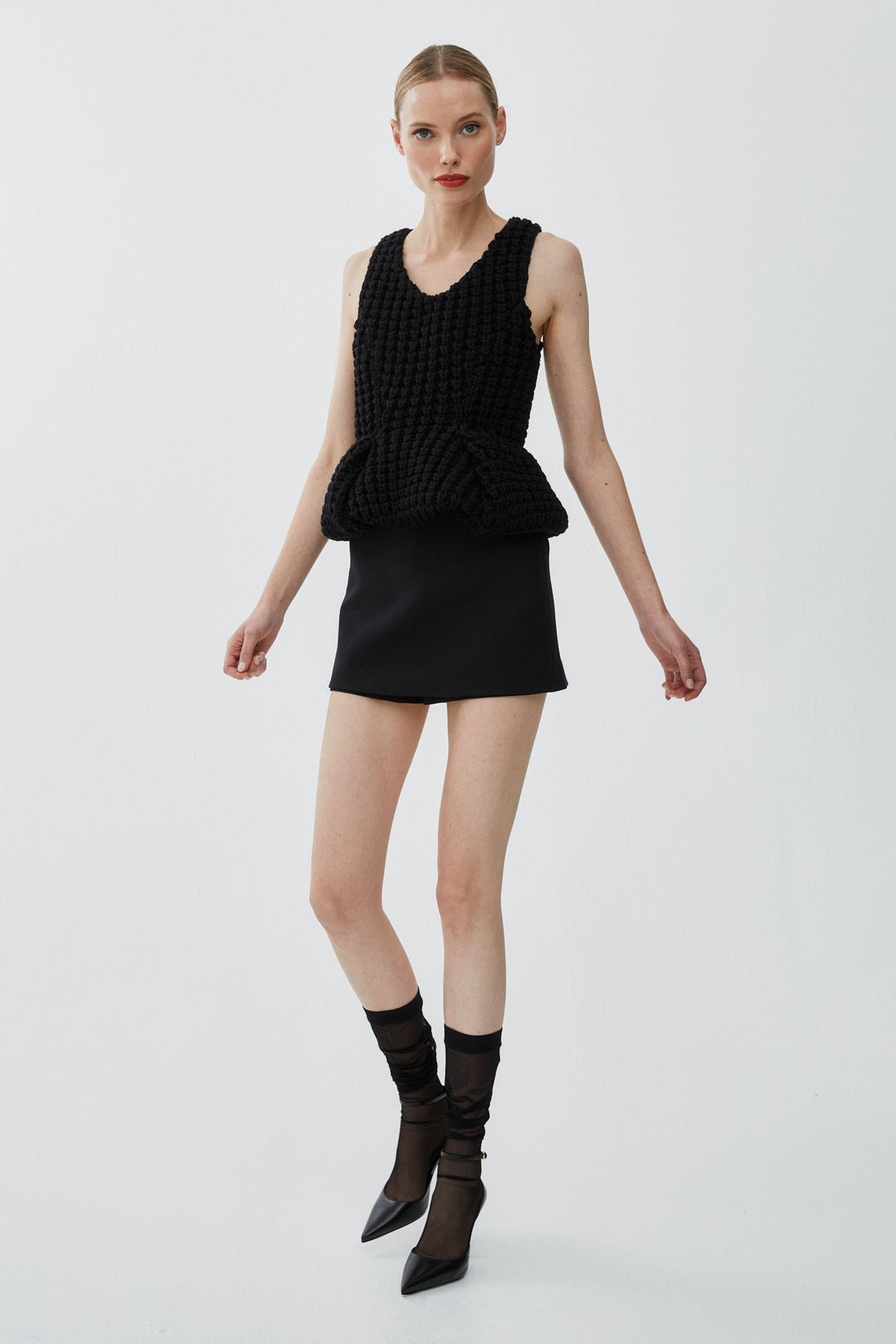 Givenchy | Slim fit peplum black top in waffle wool | Savannahs