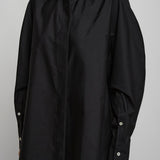 Cocoon black shirt with turned sleeves