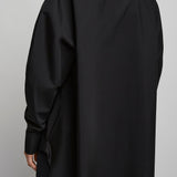 Cocoon black shirt with turned sleeves
