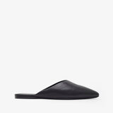Black slip-on shoe on a white background
