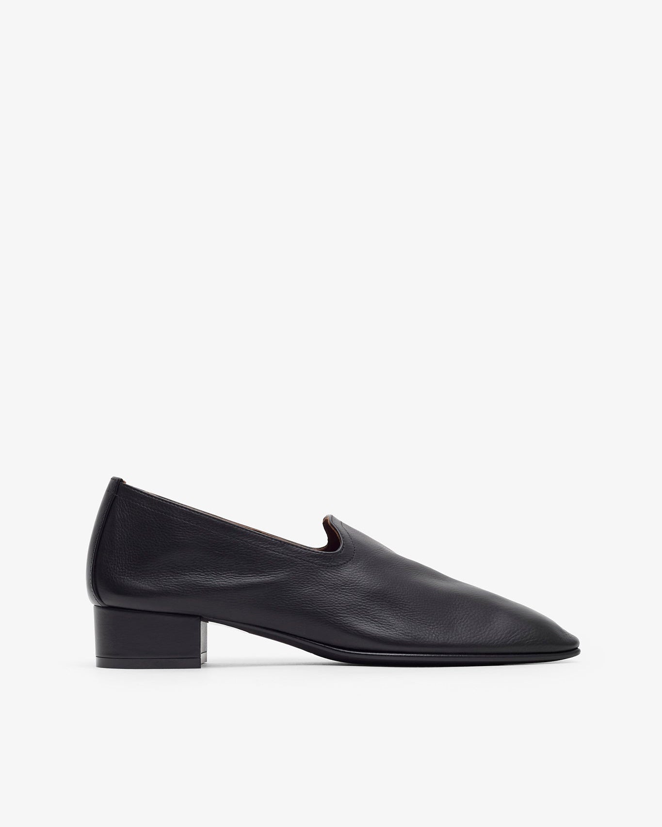 Black leather shoe on a white background