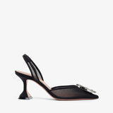 Black high-heeled shoe with a thin strap on a white background