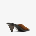 Brown sandal with a black heel on a white background