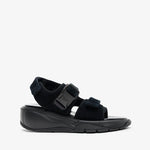 Black sandal with a thick sole on a white background