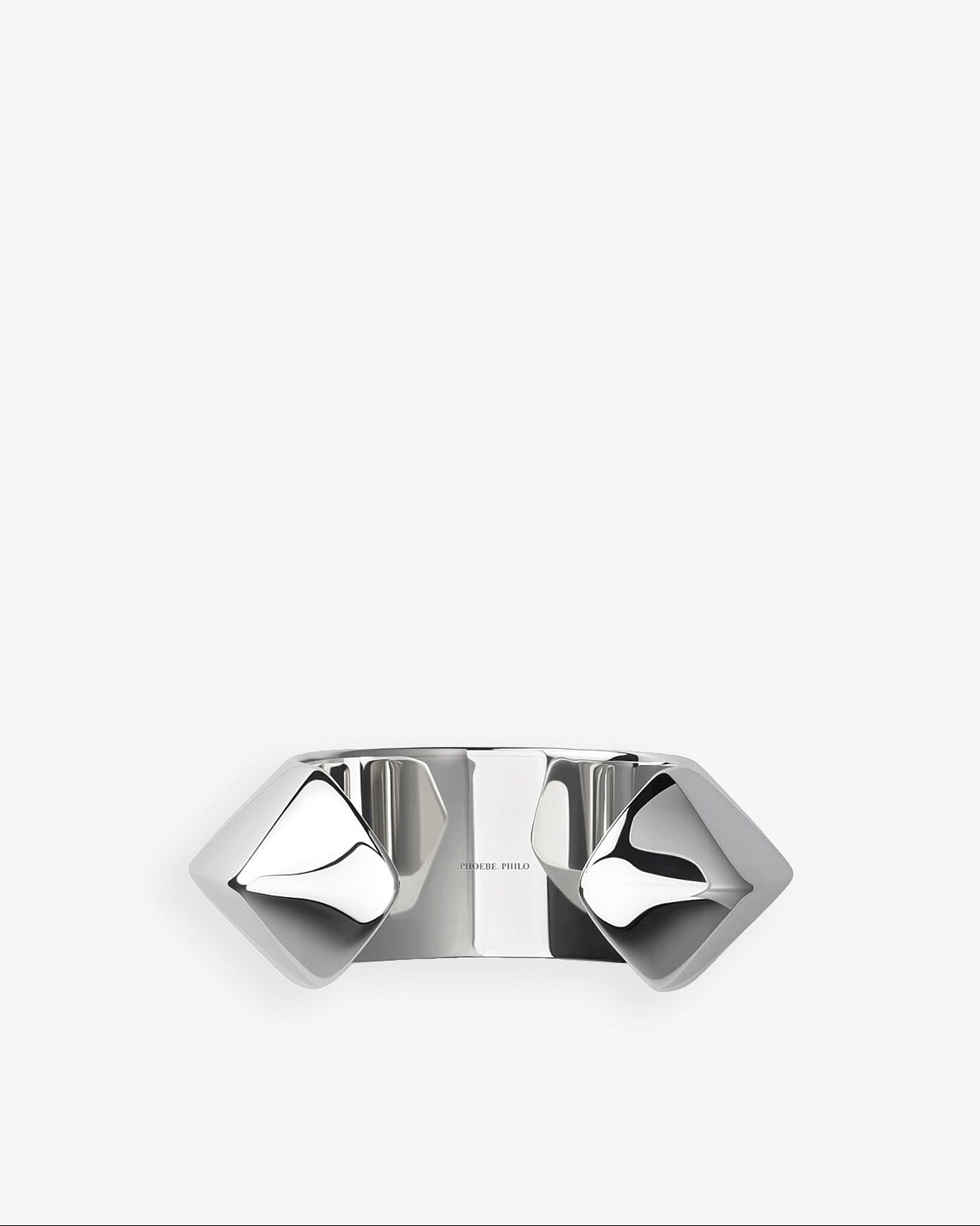 Silver ring with geometric design on a white background