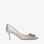 Silver high-heeled shoe with a decorative clasp on a white background