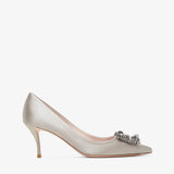 Silver high-heeled shoe with a decorative clasp on a white background