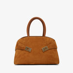 Brown handbag with gold accents on a white background