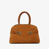 Brown handbag with gold accents on a white background