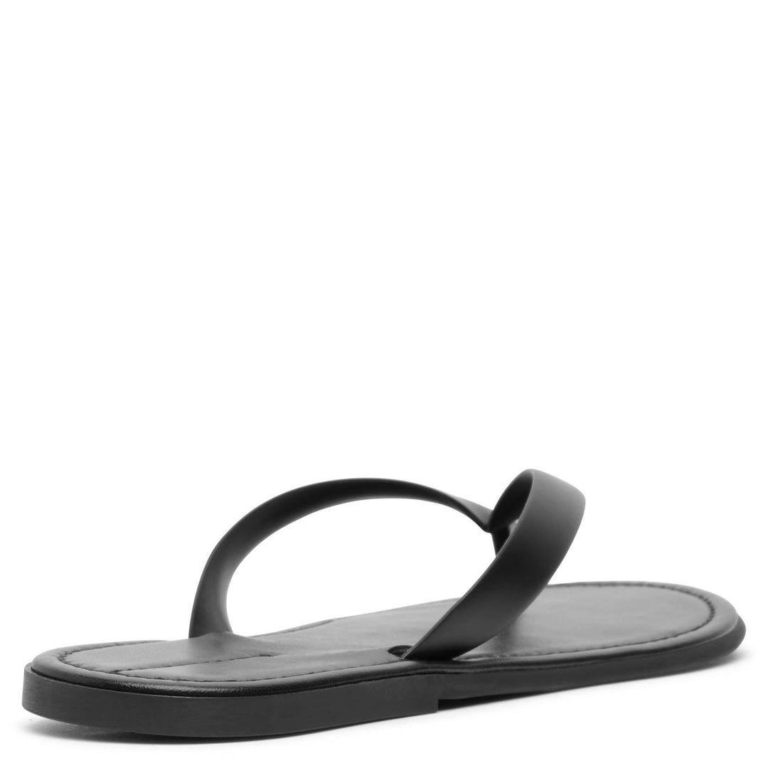 The Row | Beach black flip flop sandals | Savannahs