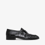 Black leather loafer on a white background