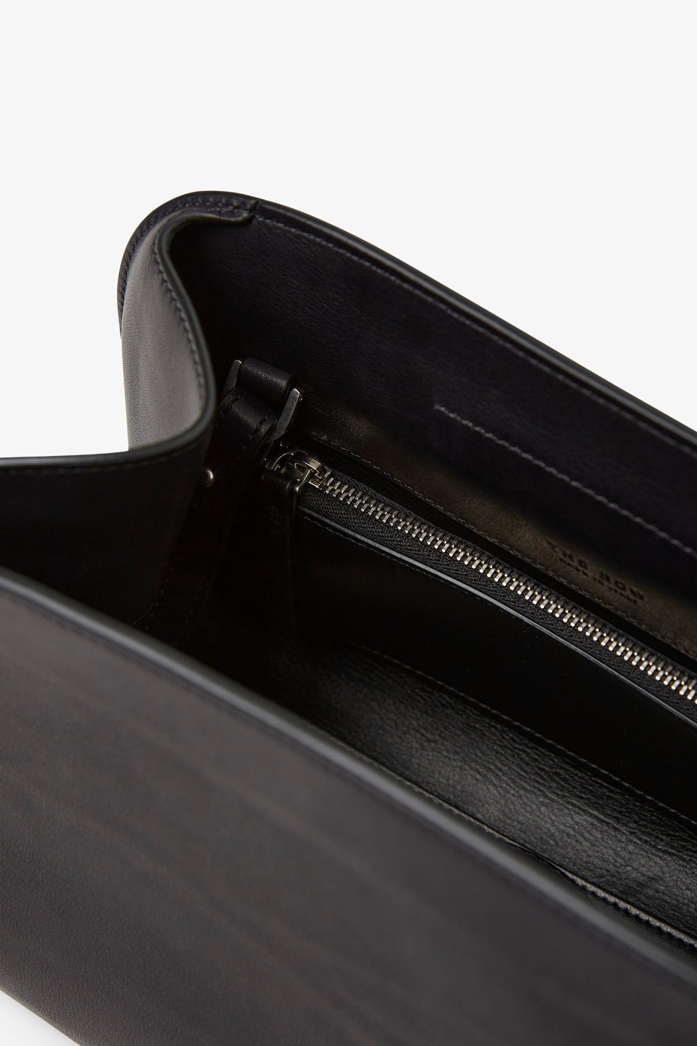 The Row | Peggy black leather clutch | Savannahs
