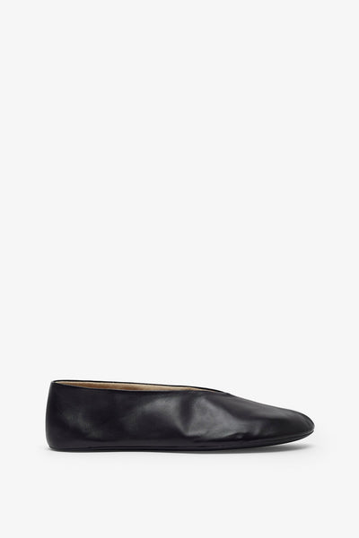 The Row | Stella black slippers | Savannahs